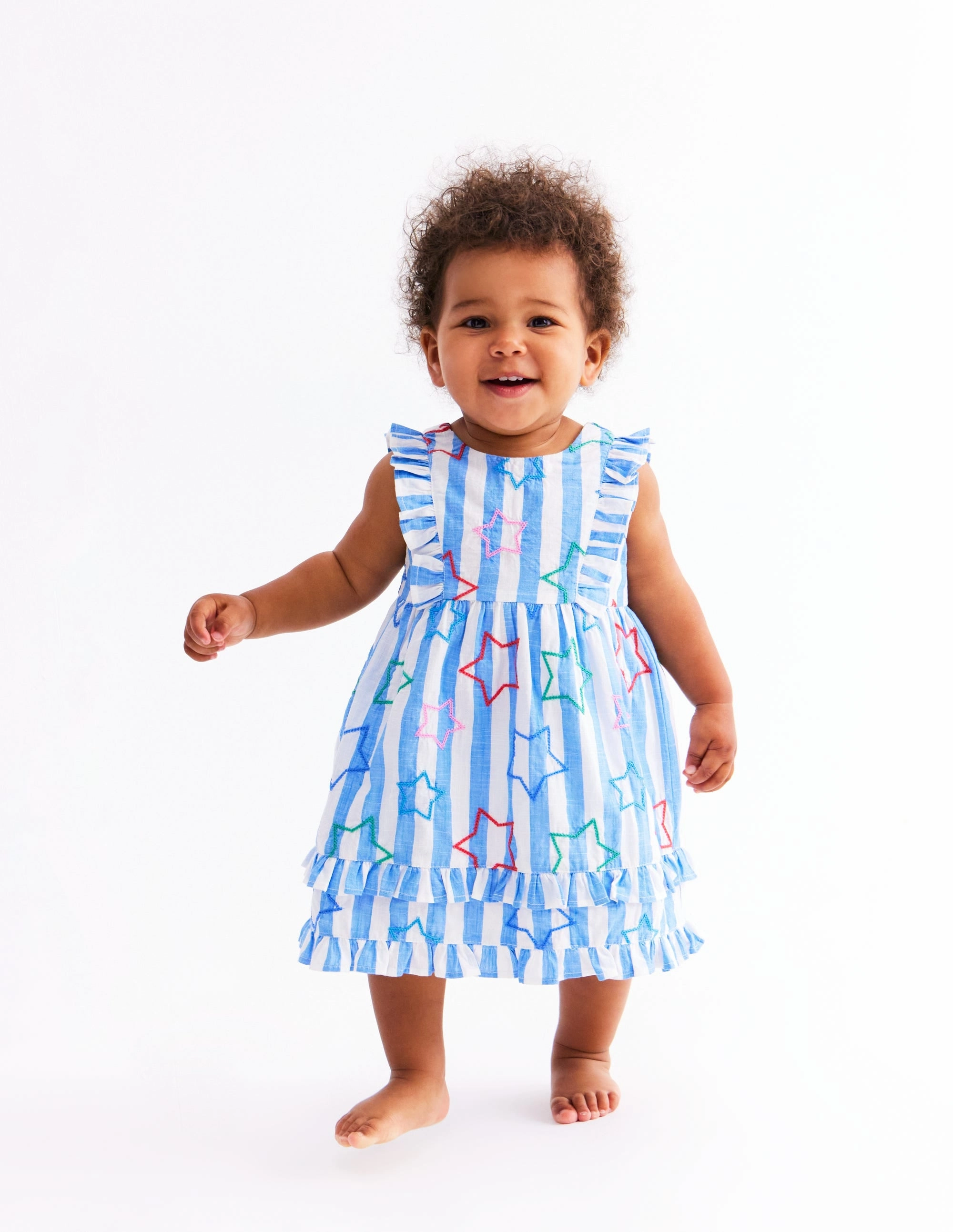 Frilly Pinny Dress-Peacock Plume Blue Star warm tones