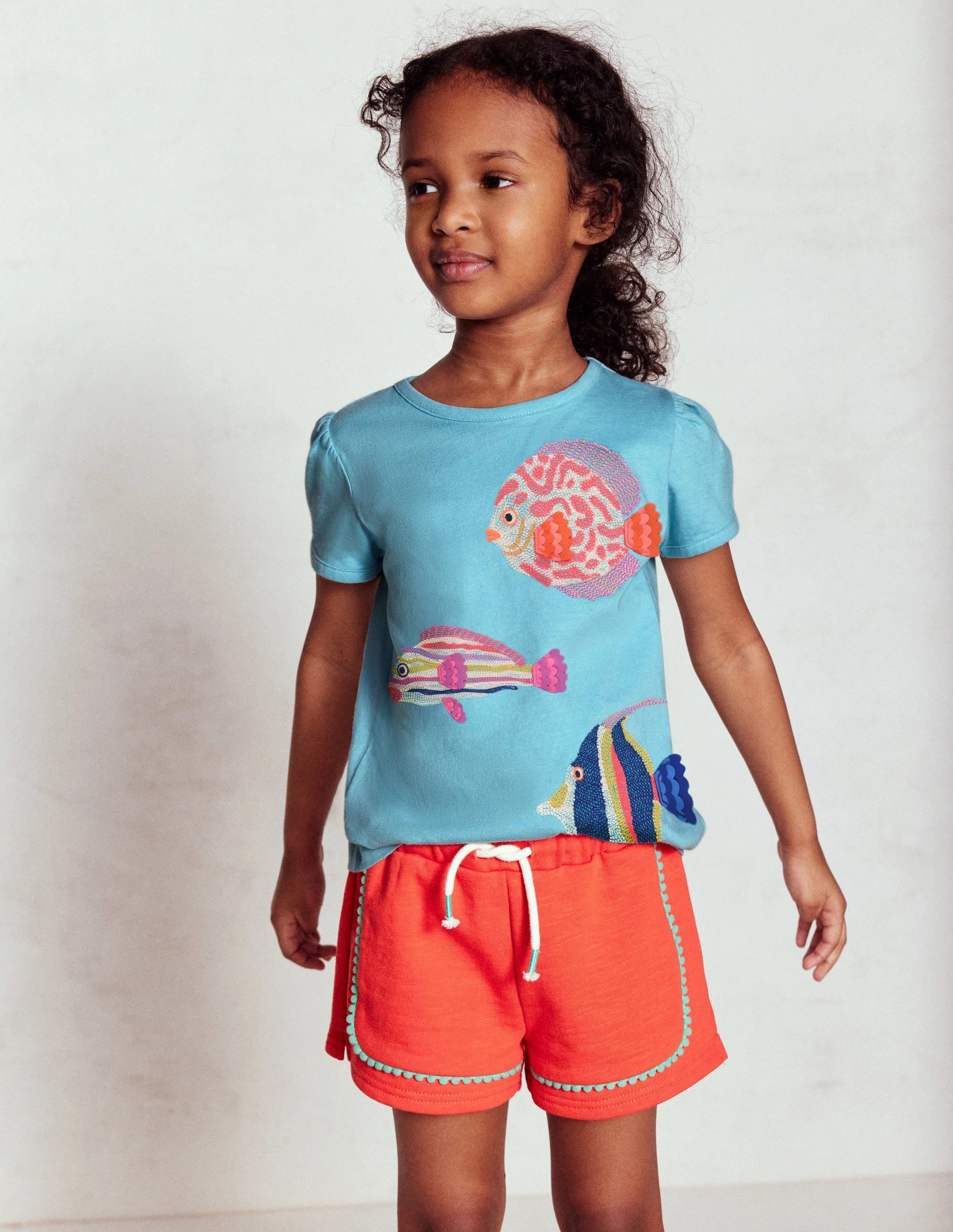 GussetDesign Comfort Movement Pom Trim Jersey Short-Firecracker Red